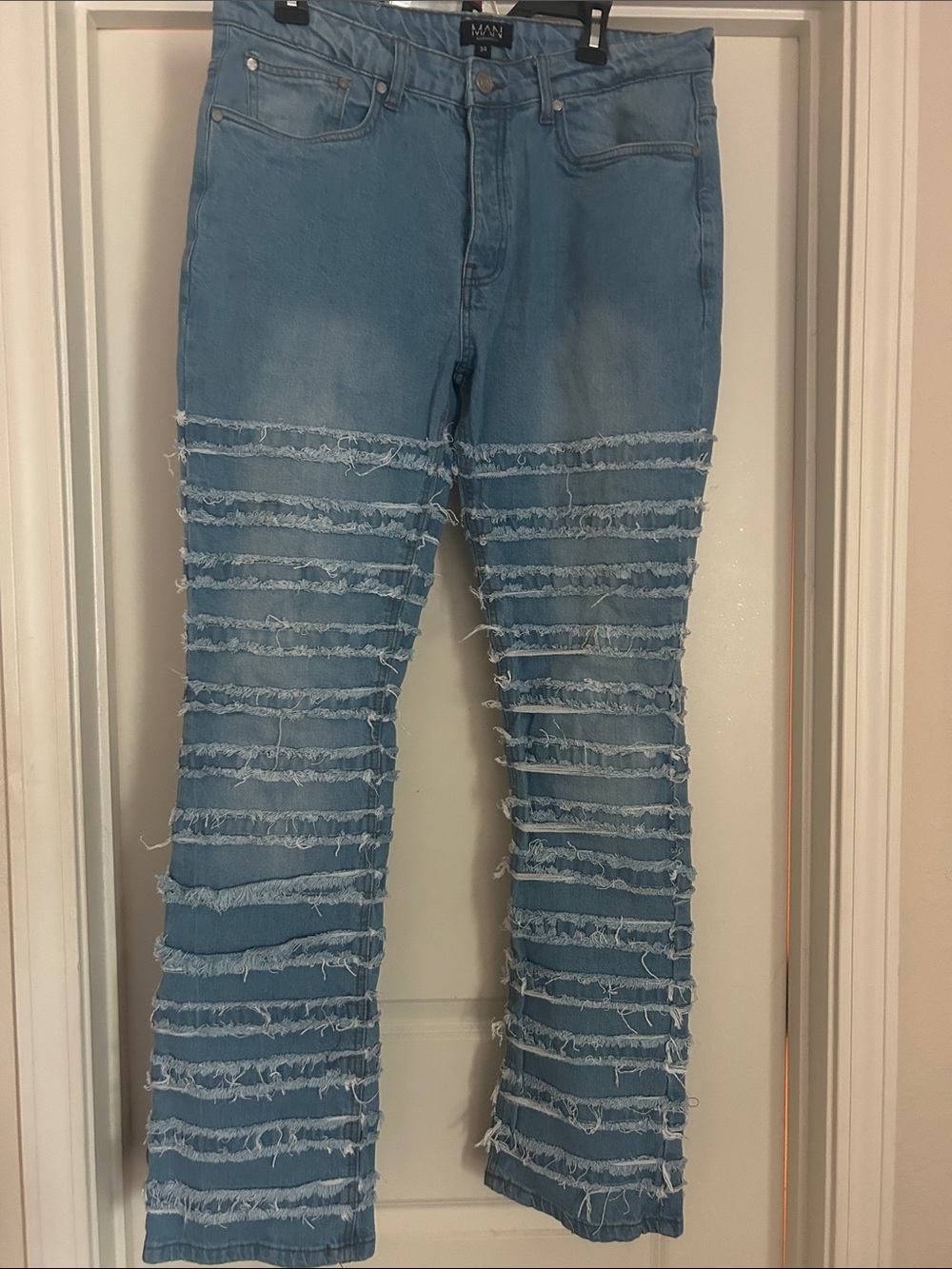 MAN Light Blue Distressed Relaxed Jeans with Frayed Stripe Detail